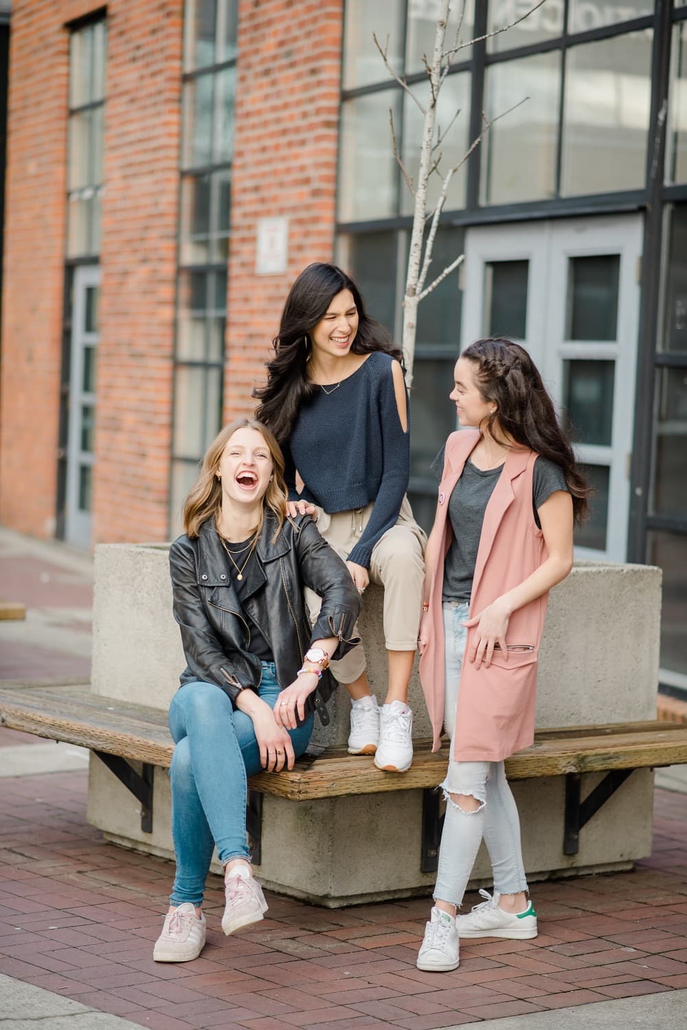 Three women from the BeaYOUtiful Foundation laughing and empowered